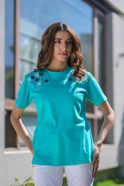 Teal crew-neck short-sleeve top with floral shoulder embroidery and straight hem