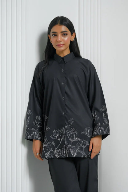 Black button-up tunic with floral print at cuffs and hem, button placket
