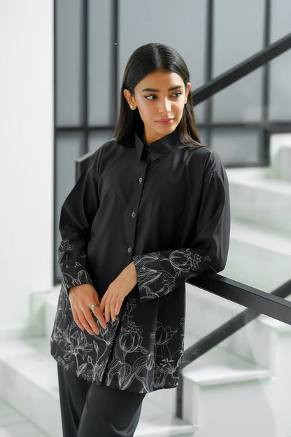 Black button-up tunic with floral print hem and sleeves, long sleeves