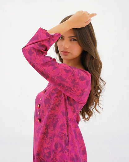 Pink patterned kurta with button placket and wide three-quarter sleeves, close-up.