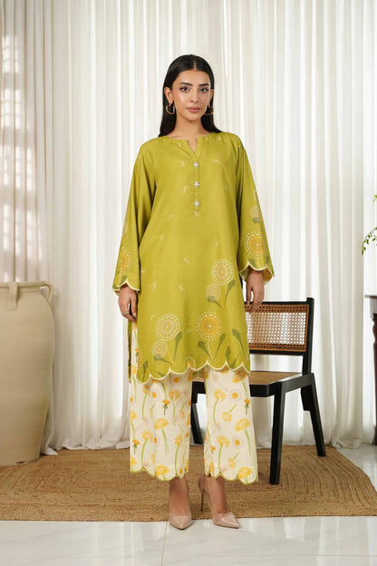 Womenâ€™s green kurta with gold center buttons and border sleeves, over printed pants