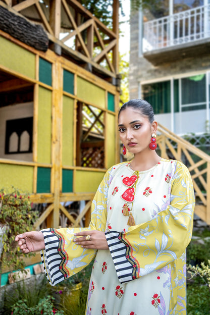 Dhaga floral maxi dress close-up, white body with red fruit print and yellow patterned sleeves