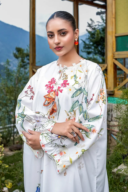 White floral maxi dress close-up: multicolor bird-and-flower print, long sleeves