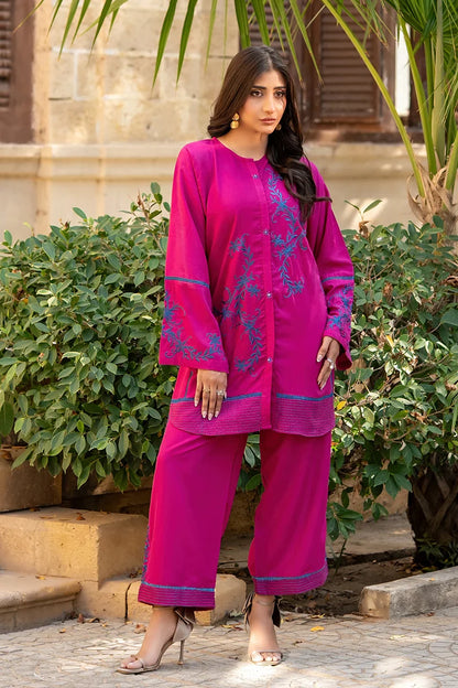 Magenta embroidered kurta set with long sleeves and matching pants, contrast cuff and hem trim