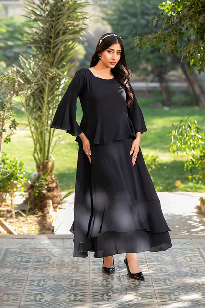 Black layered midi dress with flared 3/4 sleeves and tiered ruffle hem