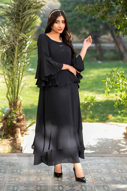 Black layered midi dress with tiered skirt and flared sleeves, full length view