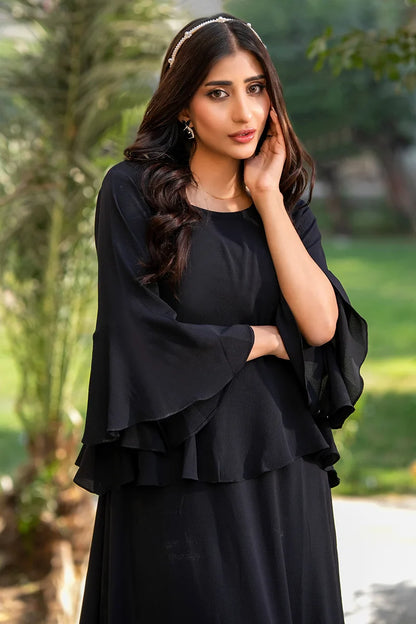 Black tiered midi dress with flared sleeves, crew neckline, and layered skirt