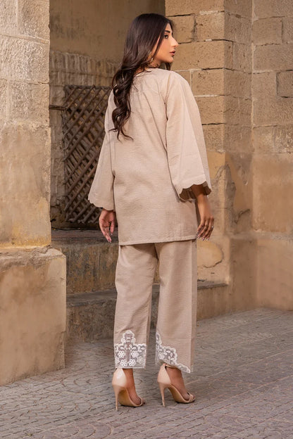 Beige embroidered tunic and straight-leg pants set with floral hem detailing