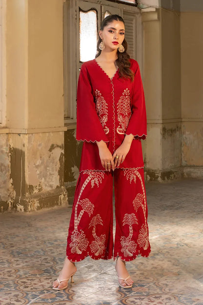 Red embroidered long kurta set with scalloped neckline, wide sleeves, and hem