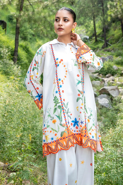 Embroidered white kurta with colorful floral motifs, dangling trim at cuffs and hem