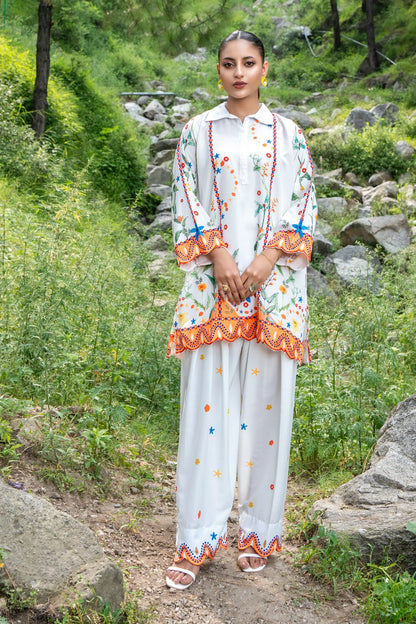 Embroidered white long kurta dress with multicolor floral and orange border trim