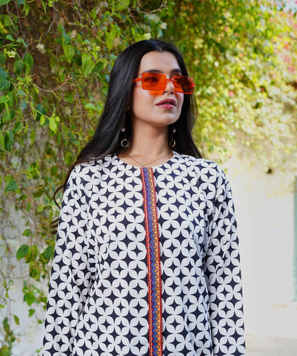 Geometric print long-sleeve jumpsuit top with orange-trim placket and round neckline