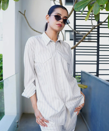 Light striped long-sleeve button-up shirt with chest pockets and collar