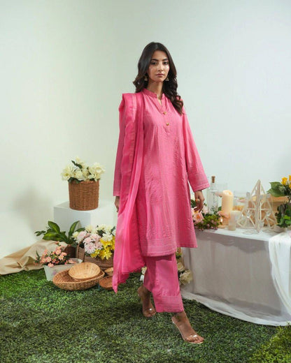 Pink long tunic with matching pants, stand collar, button front, long sleeves.
