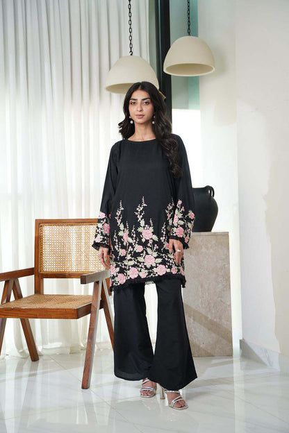Dhaga black tunic with pink floral hem and cuffs, flowing black pants