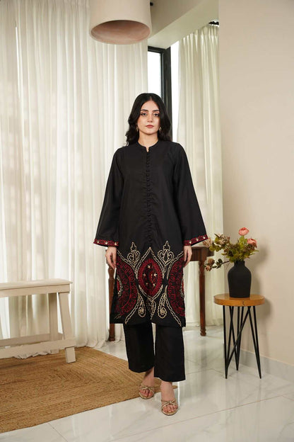 Women’s black embroidered tunic with red/gold detailing at hem and cuffs, long sleeves