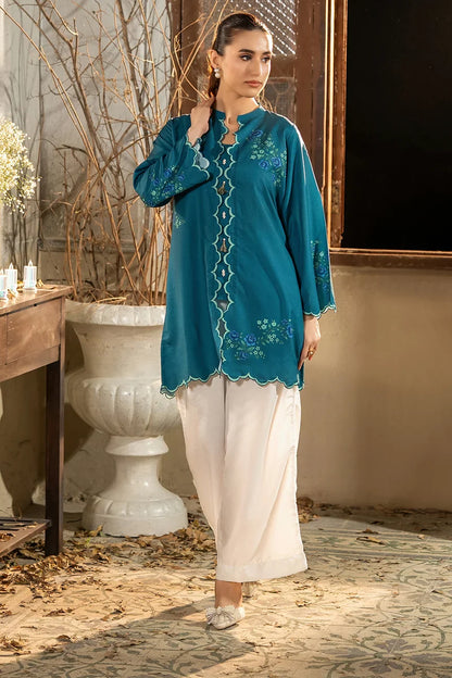 Teal embroidered kurta with scalloped neckline and cuffs, worn over white straight pants