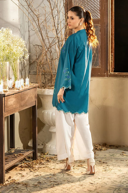 Back view of teal embroidered kurta with scalloped edge, with white straight pants