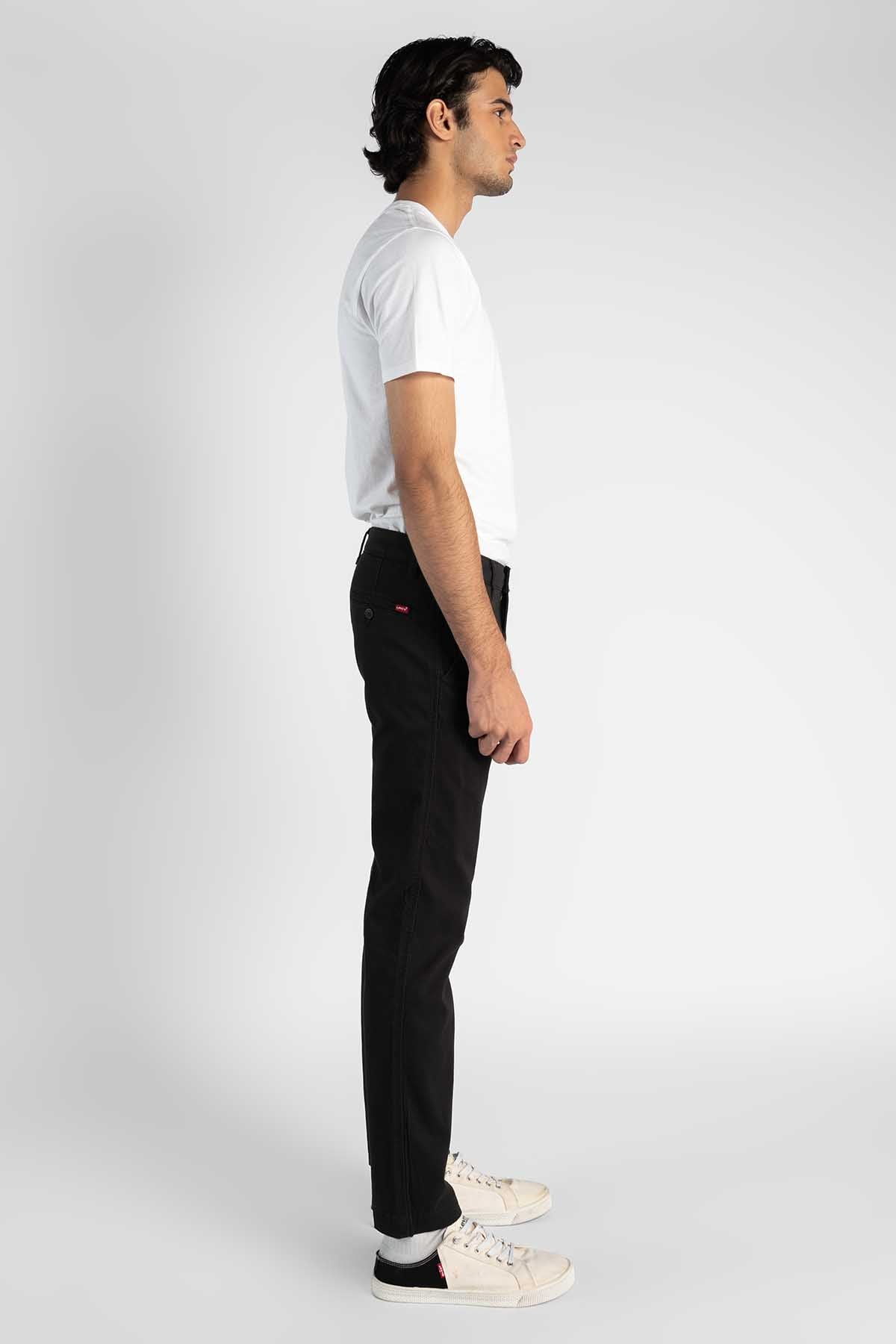 Men's black jeans, side view, straight leg
