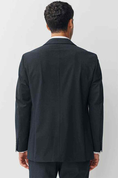 Navy suit jacket back view with center seam and buttoned cuffs
