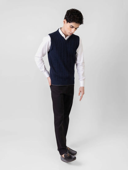 Brumano navy V-neck cable-knit sleeveless vest worn with trousers