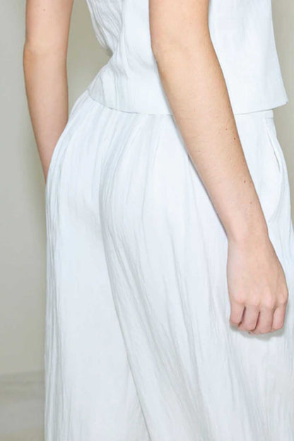 White wide-leg trousers, gathered waistband and pleated front