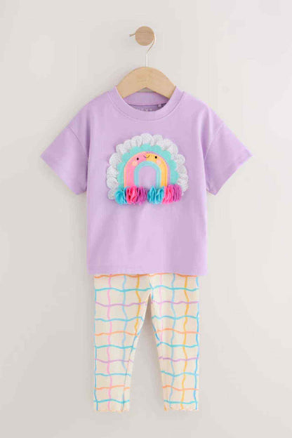 Lilac kids T-shirt and leggings set on wooden hanger, rainbow graphic on chest
