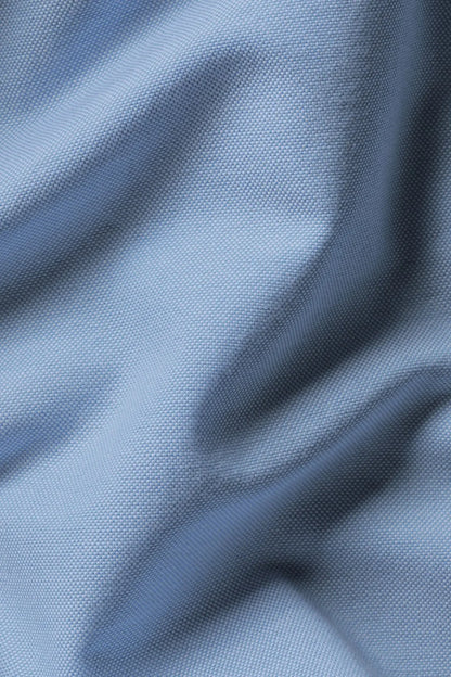 Light blue woven shirt fabric texture close-up