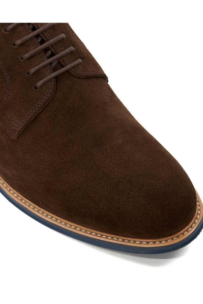Brown suede lace-up shoe with stitched edging and textured sole trim in blue and orange