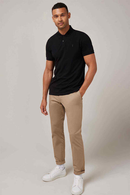 Men's black polo shirt, front view with short sleeves and button placket
