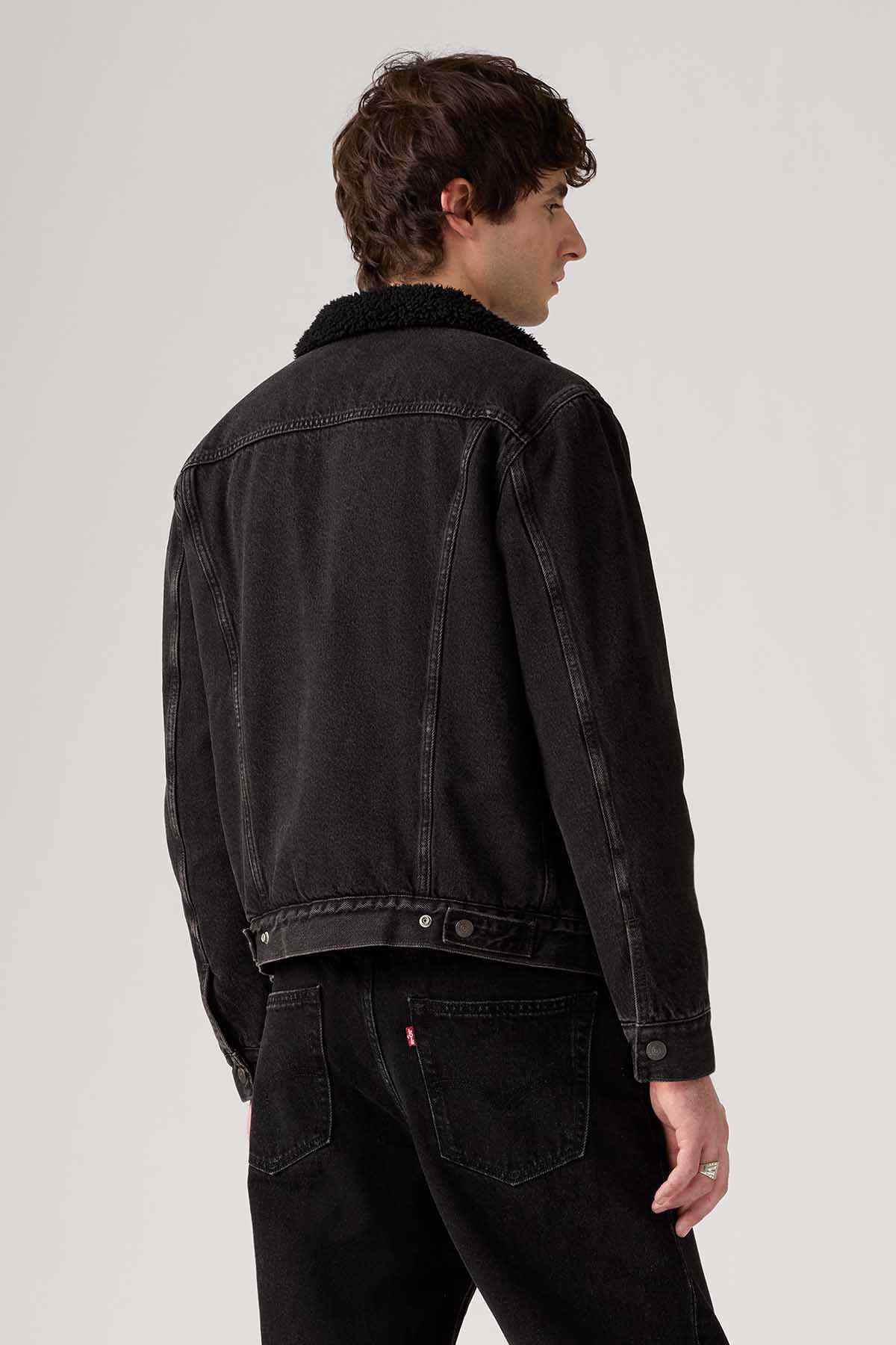 Levi's black denim jacket rear view with yoke seam and button cuffs