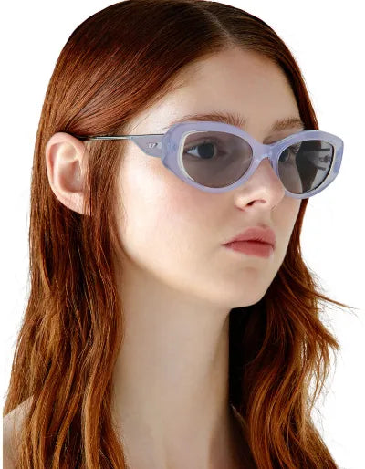 Diesel light blue oval sunglasses with gray lenses and rounded frame arms