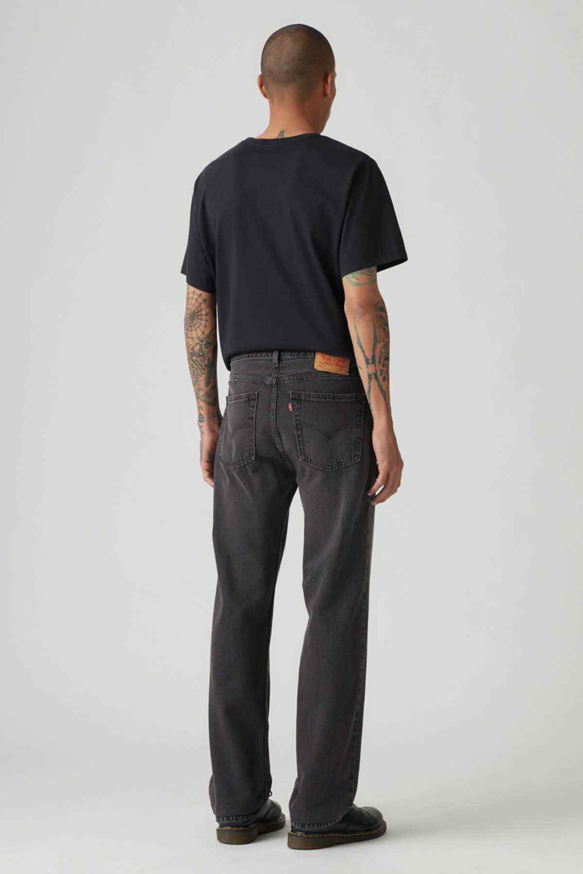 Levi's black denim jeans, back view with belt loops and straight leg