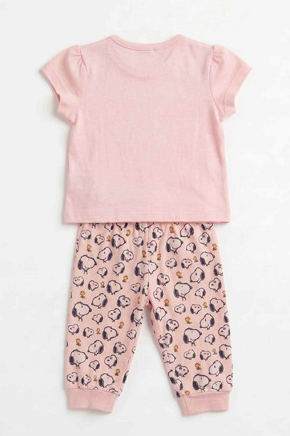 Pink baby pajama set, back view: solid T-shirt with snoopy-pattern pajama pants