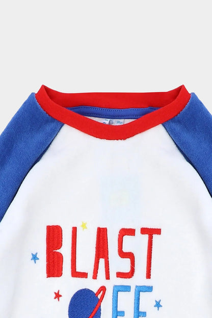 White and blue raglan baby pajama top with red trim and “BLAST OFF TO BED” print