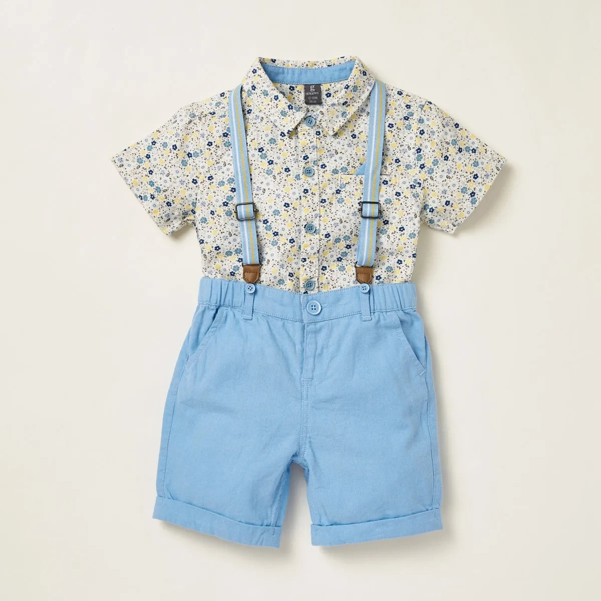 Baby patterned short-sleeve shirt with light blue shorts and suspenders, front view