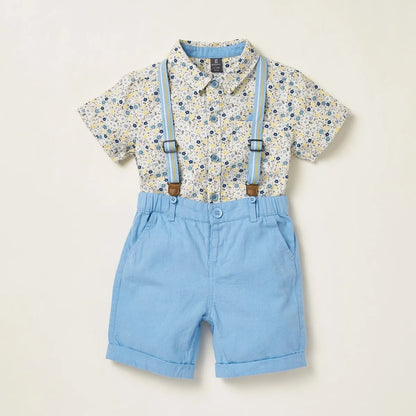Baby patterned short-sleeve shirt with light blue shorts and suspenders, front view
