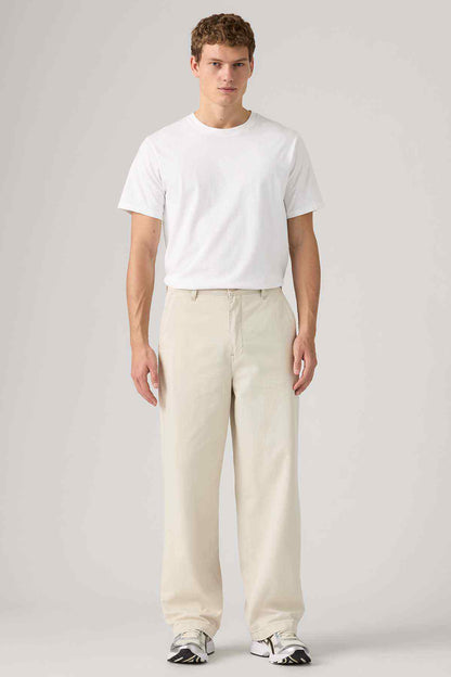 Levi's white crew-neck T-shirt with light beige pants
