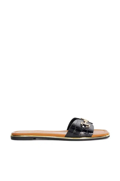 Dune London black slide sandals with gold buckle strap and tan footbed