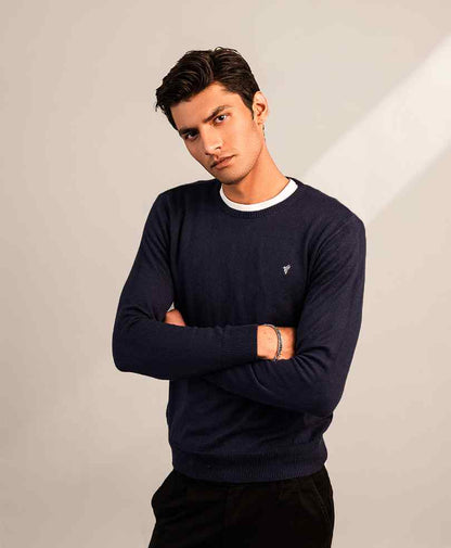 Navy fitted crewneck sweater with white rib trim and small chest logo