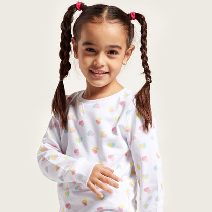 Kids pajama top in white with multicolor heart-shaped pattern and long sleeves