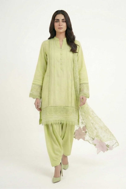 Light green embroidered kurta set with sheer floral dupatta draped at the side