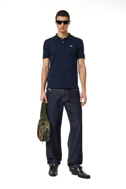 Navy Diesel polo shirt with button collar and small chest logo, model wearing sunglasses