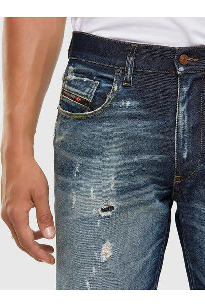 Men's blue jeans close-up of front pocket and whiskered wash
