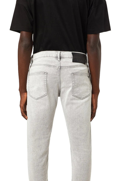 Diesel light grey denim jeans, back view, two rear pockets, belt loops, button fly