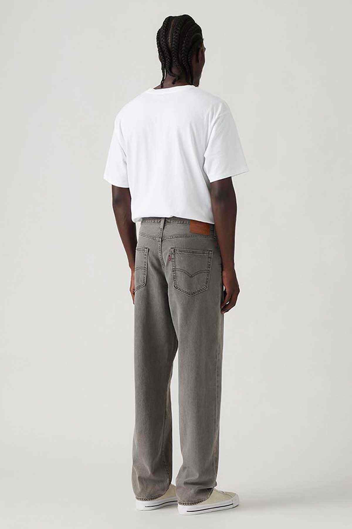 Grey denim jeans, back view with patch pockets and belt loops