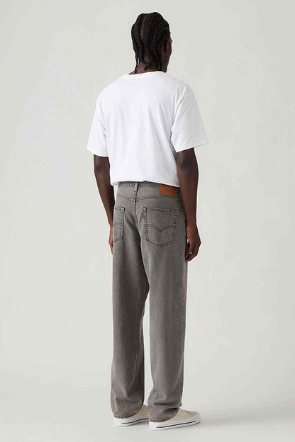Grey denim jeans, back view with patch pockets and belt loops