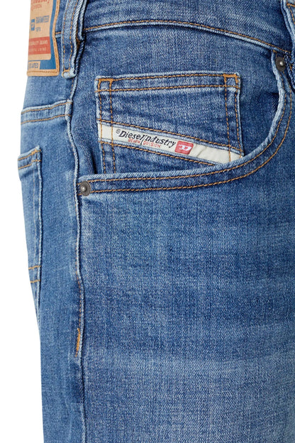Blue denim jeans close-up of front pocket and orange-stitched seam detail