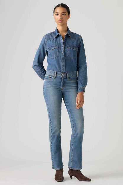 Women's medium-wash denim jeans, mid-rise bootcut with belt loops and button fly
