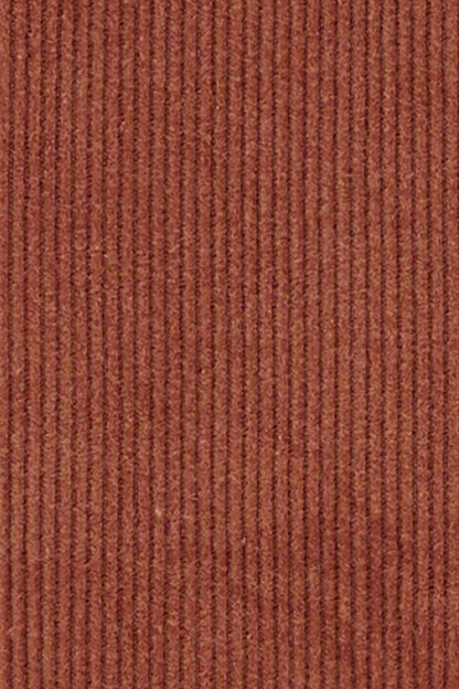 Brown corduroy overalls fabric close-up with fine vertical texture